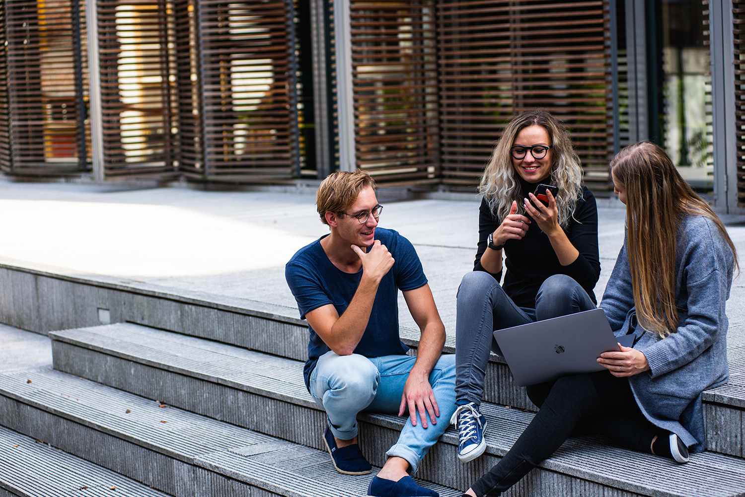 Students sitting on steps.