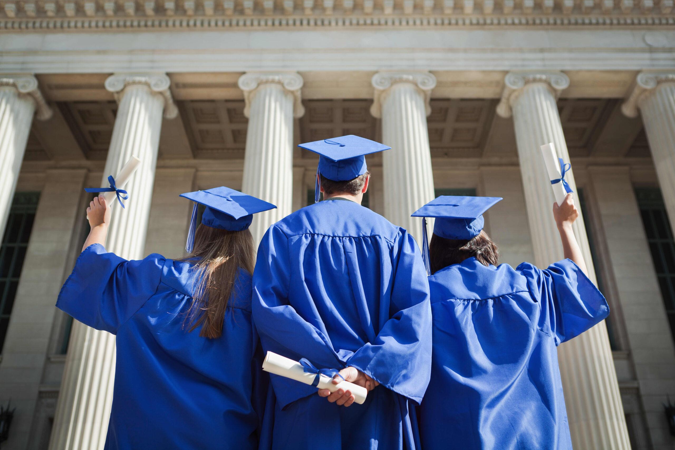 A group of students wearing blue gowns.