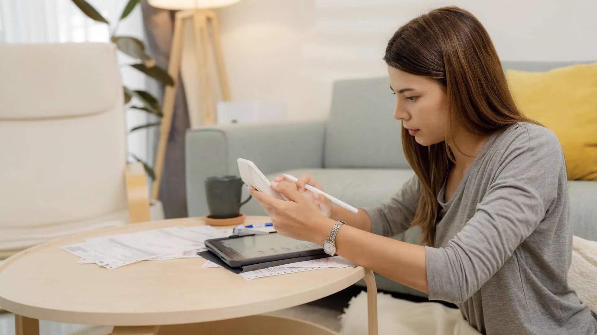 Woman using a calculator.