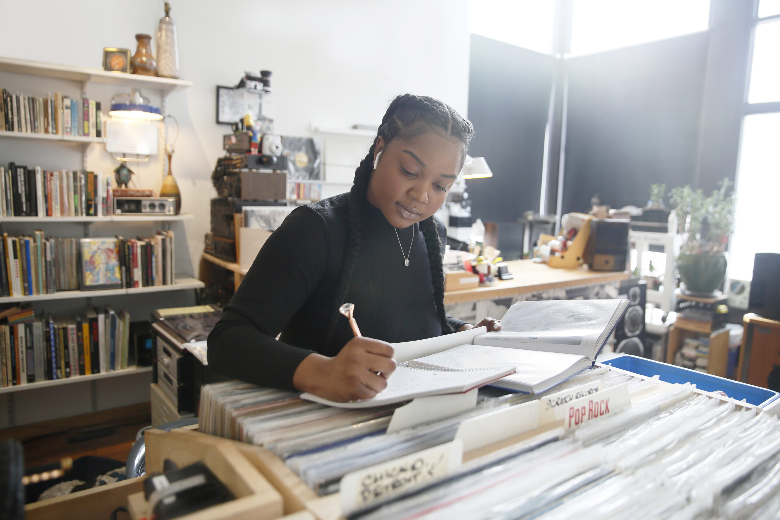 A young African-American woman studying.