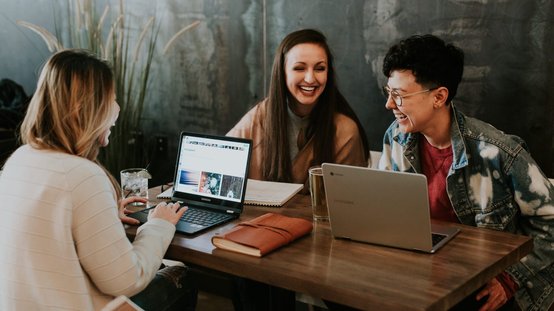 Students laughing together while working.