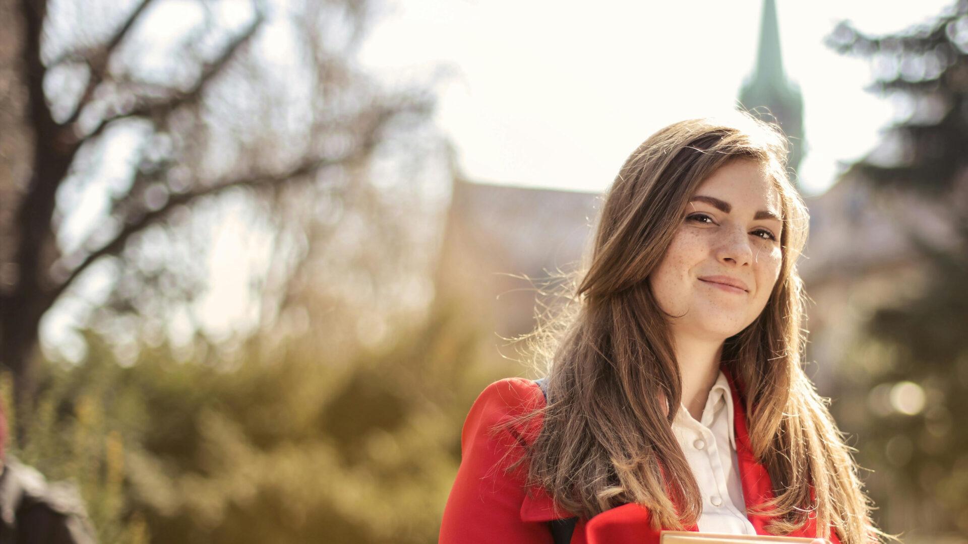 Confident woman in a park environment.