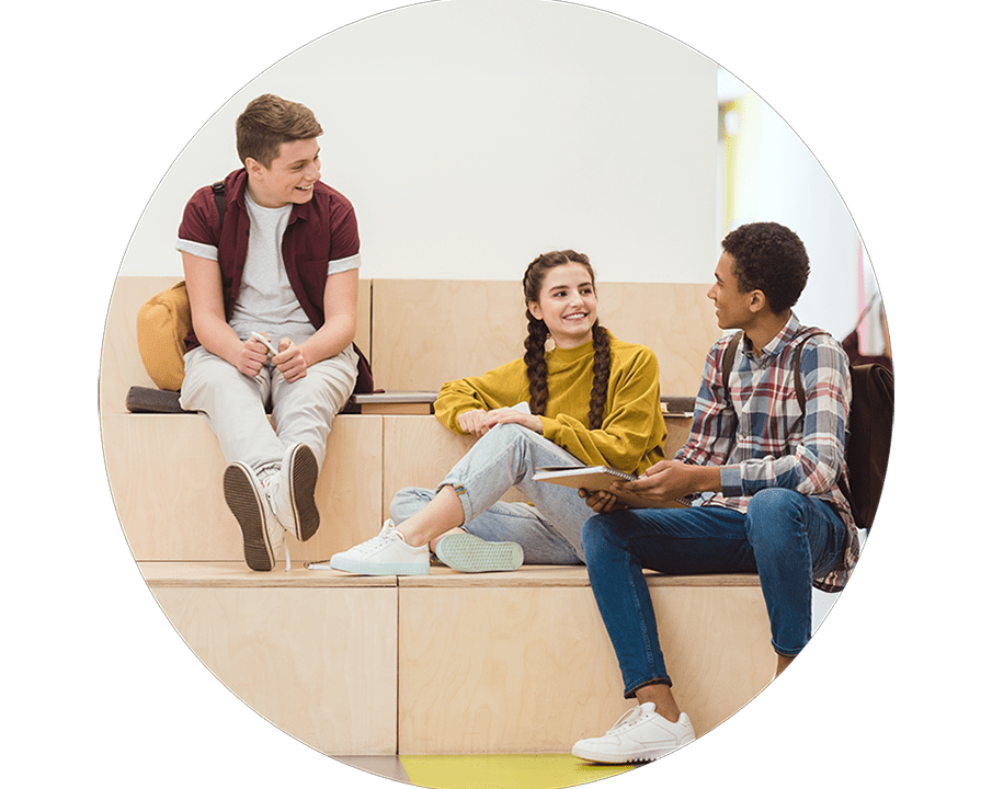 Three students talking at school