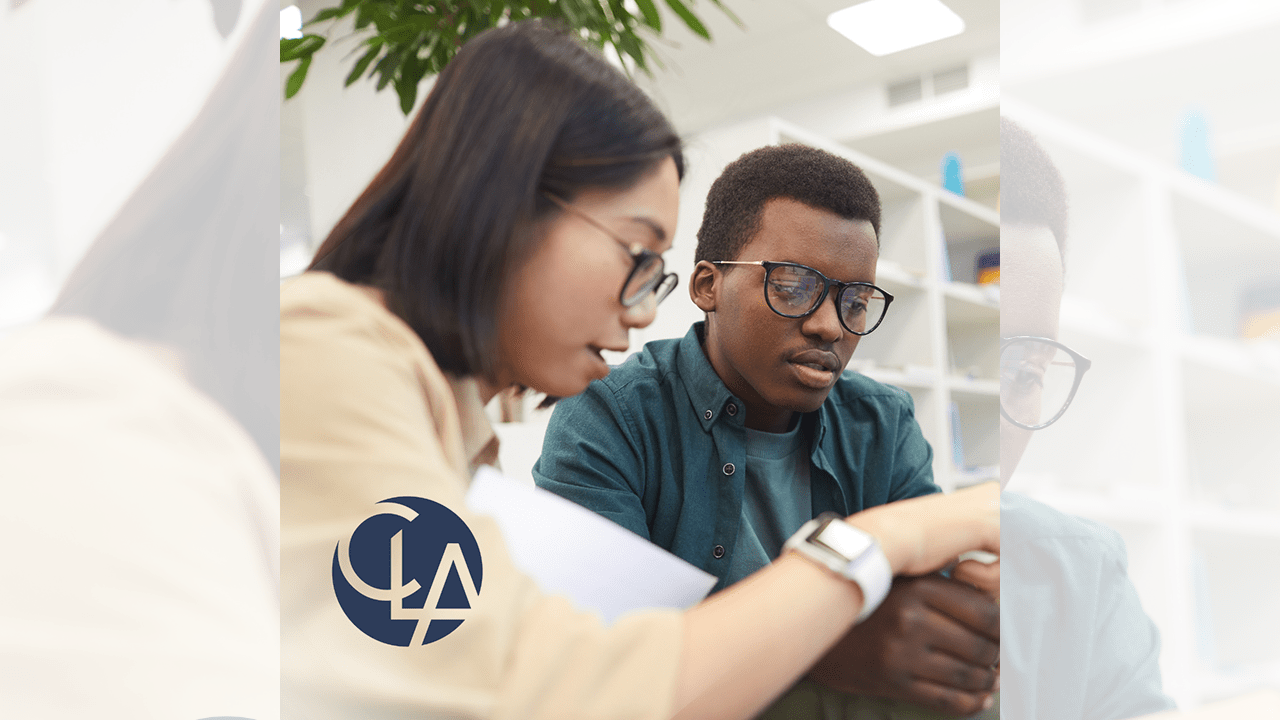 A black male and an Asian American female wok on a classroom project together. Image includes the logo of CLA